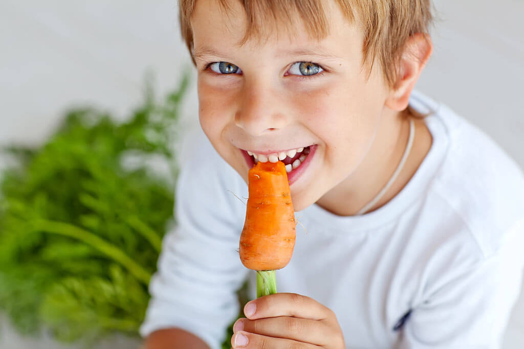 chld-eating-carrot-natures-toothbrush (1)